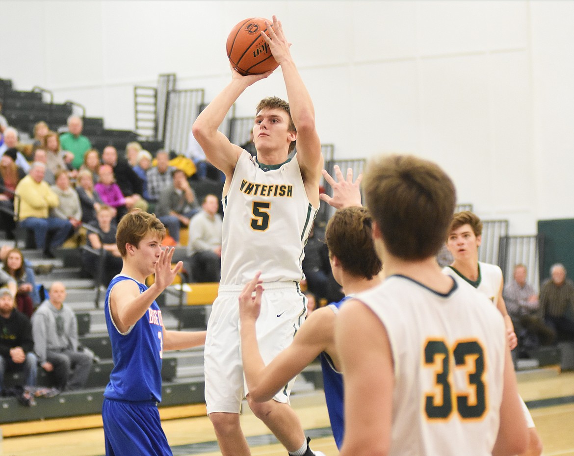 Derek Kastella attempts a game-tying three as time expires against Bigfork Friday.