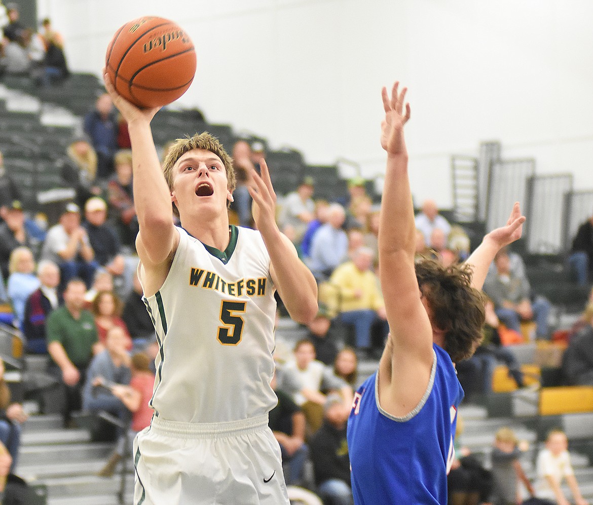 Derek Kastella puts up a floater against Bigfork on Friday.