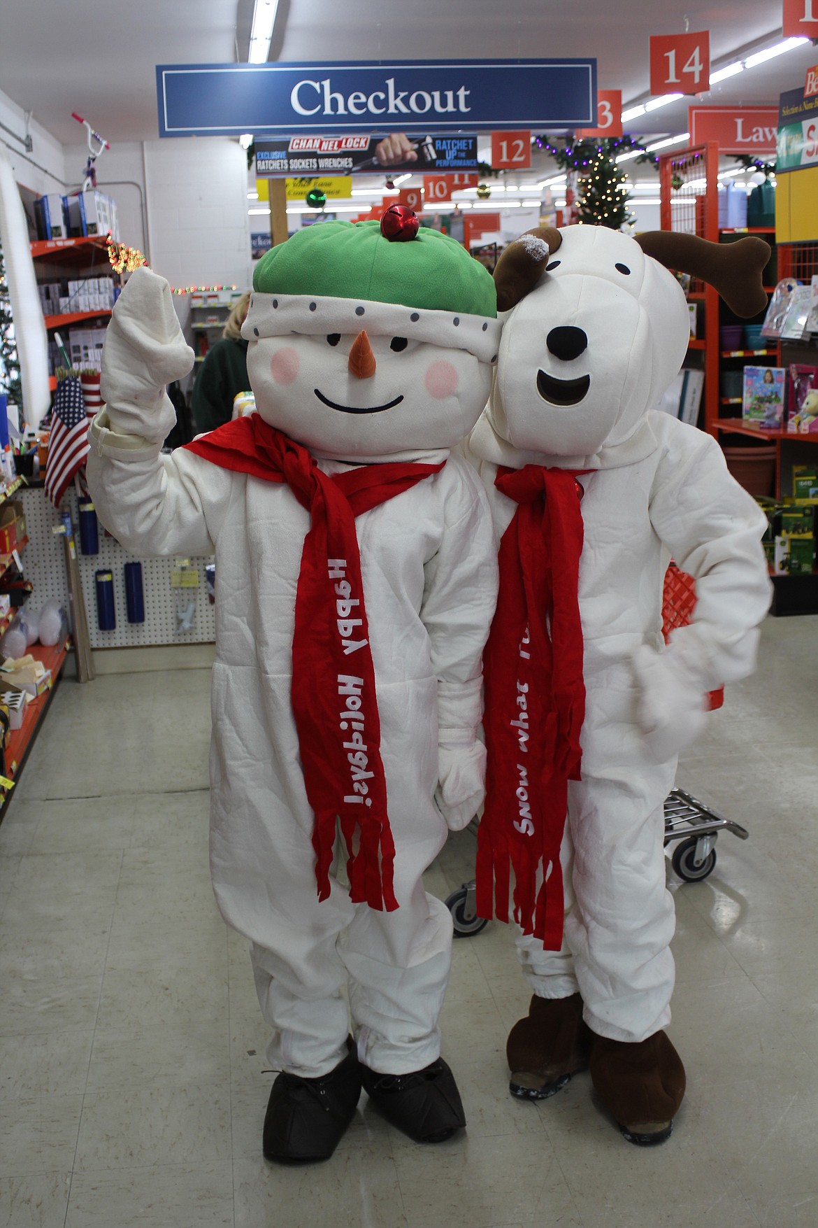 FROSTY AND Snoopy wave hello at Gambles in Plains on Saturday. (Douglas Wilks/Clark Fork Valley Press)