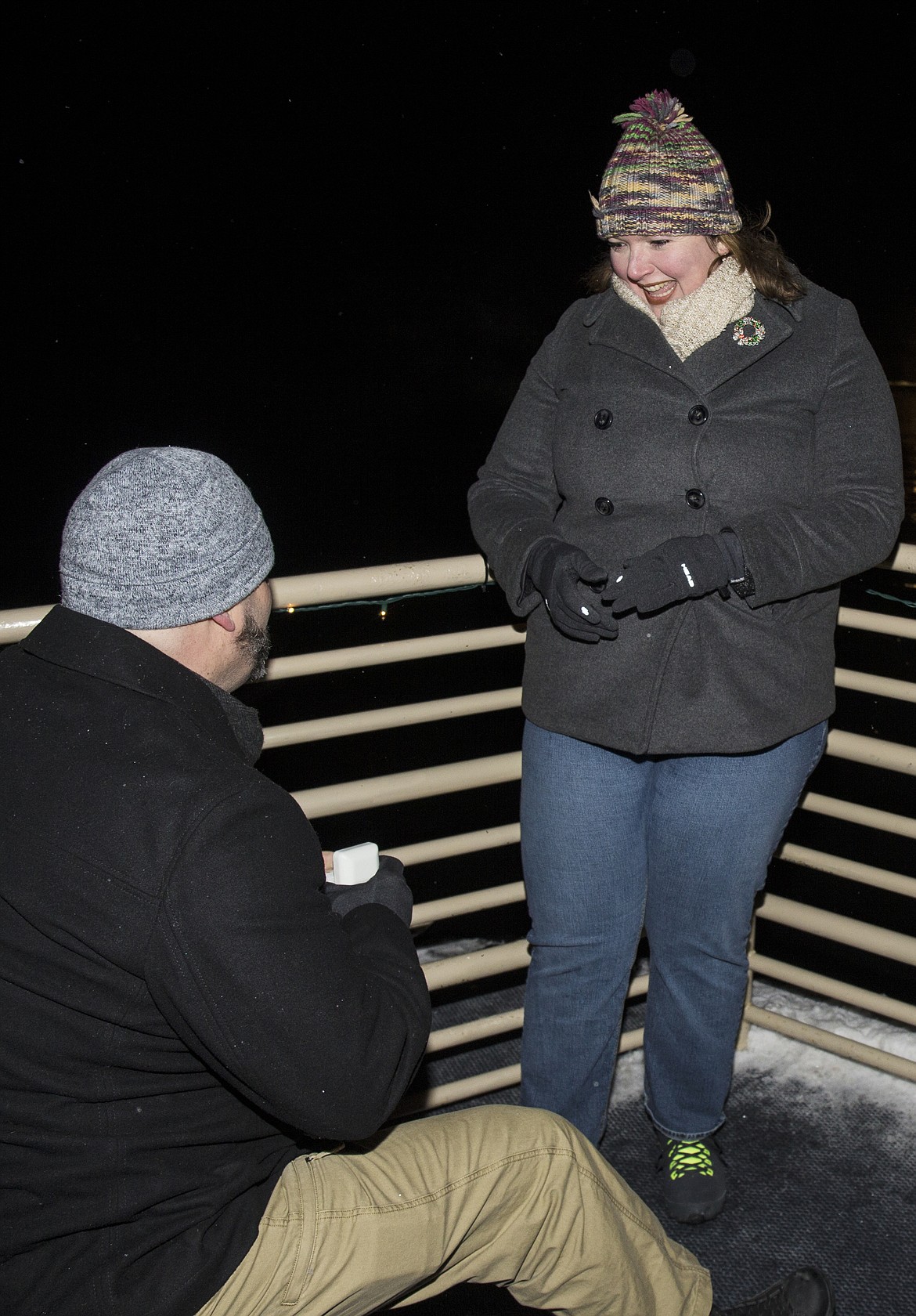 LOREN BENOIT/Press
Raymond Pearson bends on one knee to propose to his girlfriend, Michelle Beck, on a Holiday Light Show&#146;s Journey to the North Pole Cruise on Saturday night.