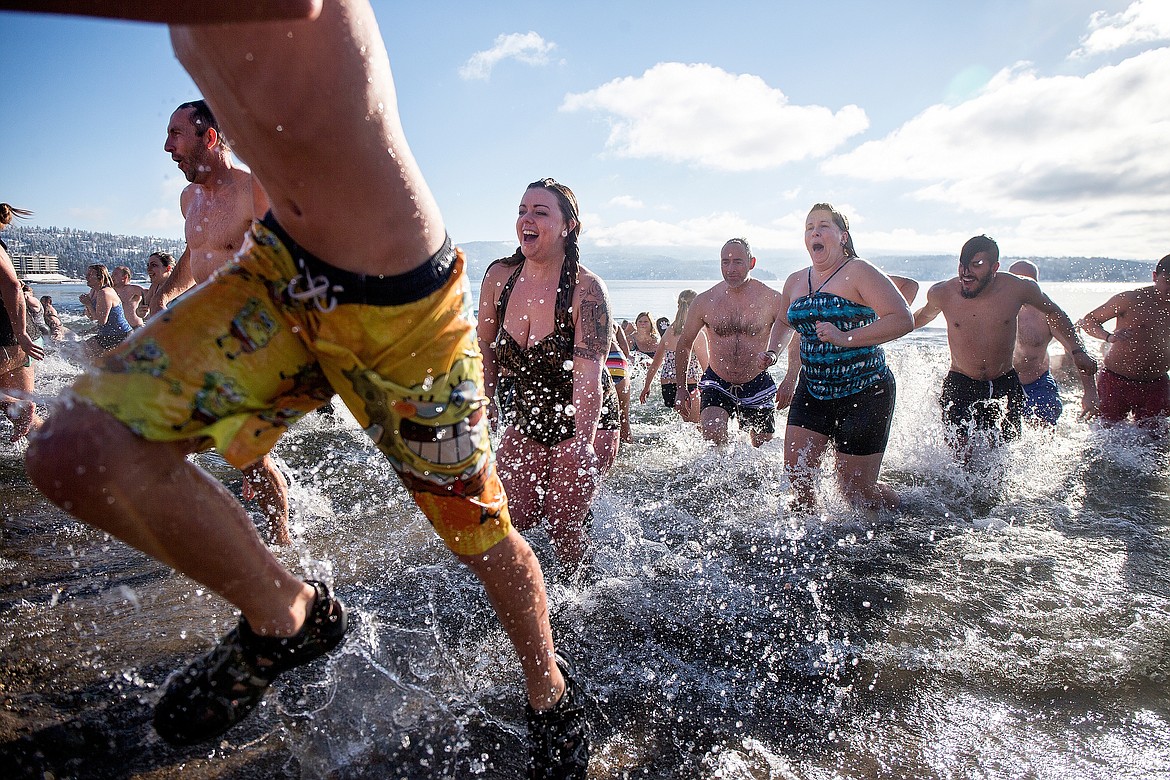 JAKE PARRISH/Press file
The brave race back to the sandy beach after taking a dip in frigid Lake Coeur d&#146;Alene during the annual Polar Bear Plunge on Jan. 1, 2016, at Sanders Beach in Coeur d&#146;Alene.