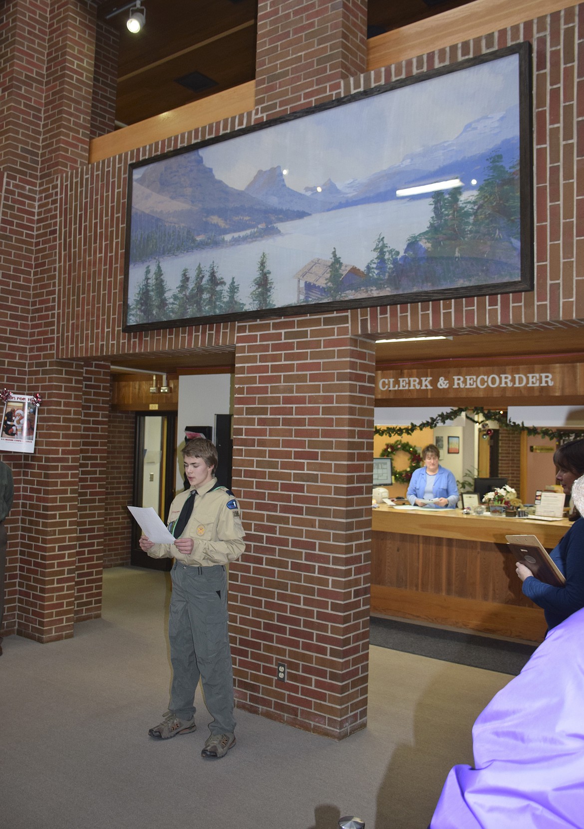 BOY SCOUT Ethan McCauley addresses the crowd during the official unveiling of the restored mural St. Mary Lodge at the Lake County Courthouse in Polson, Dec. 19. (Brett Berntsen/Lake County Leader)