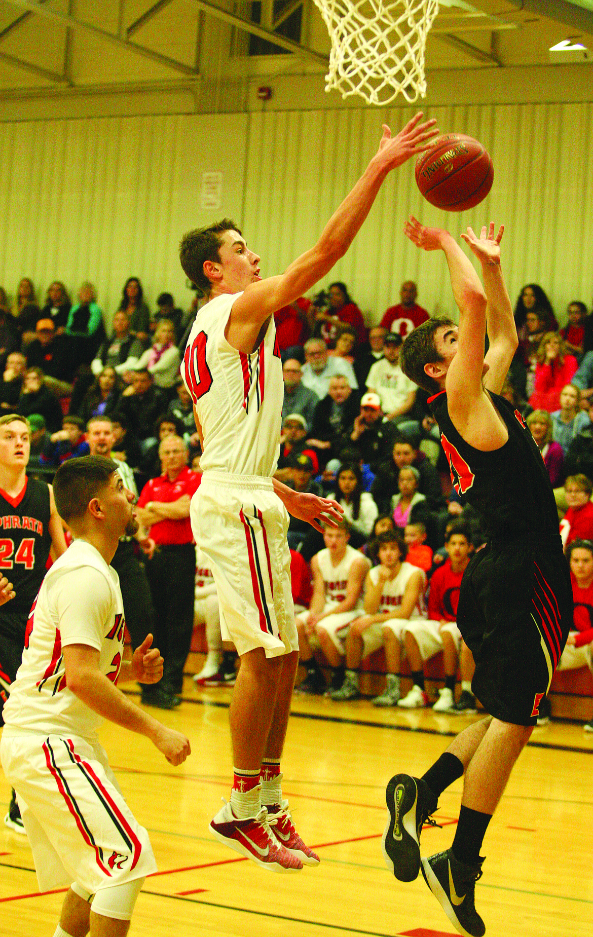 Rodney Harwood/ Columbia Basin Herald
Othello's Kyler Villarreal (center) blocks a shot against Ephrata.