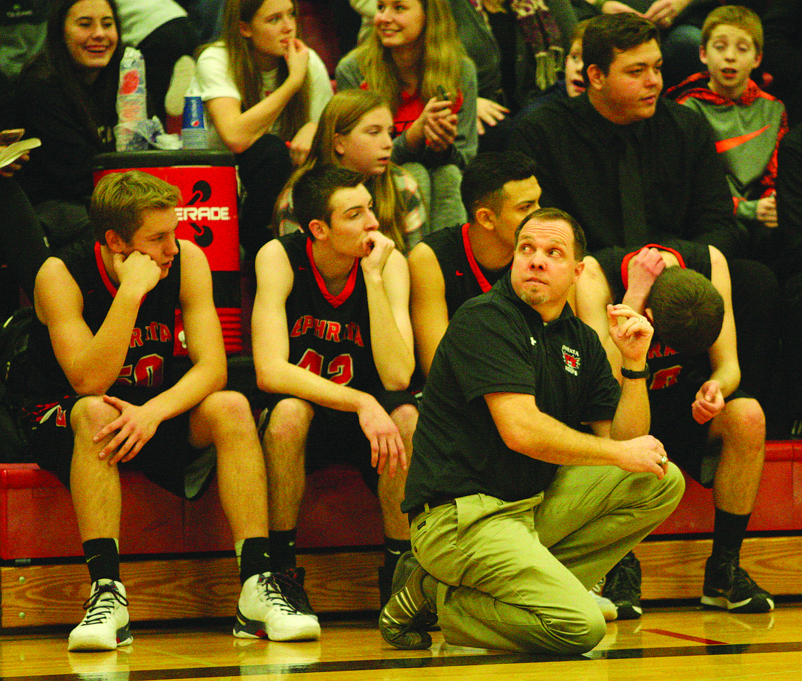 Rodney Harwood/Columbia Basin Herald
Ephrata head coach Brandon Evenson checks the scoreboard during his team's game against Othello.