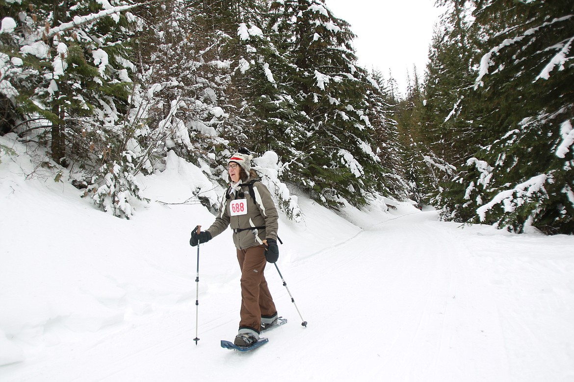 DEVIN HEILMAN/Press
Ellie Emm of Post Falls snowshoes in from the trails Saturday at the Fourth of July Pass Recreation Area during the Panhandle Nordic Ski and Snowshoe Club's Best Hand event, which annually takes place on Idaho Department of Recreation's Free Ski Day.