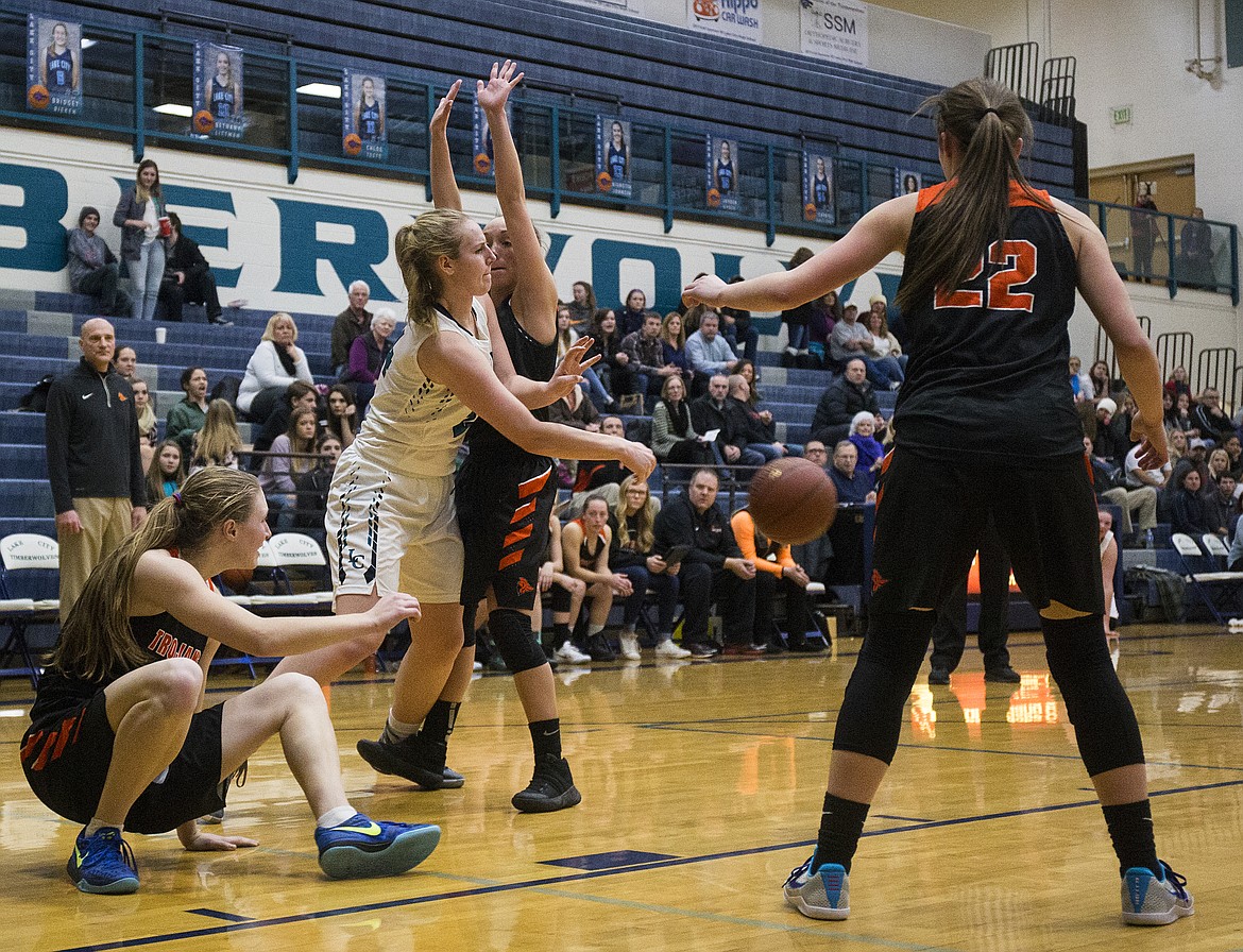 LOREN BENOIT/Press

Lake City&#146;s Capriel Halliday passes to a teammate through the Post Falls defense during Thursday&#146;s game at Lake City High School.