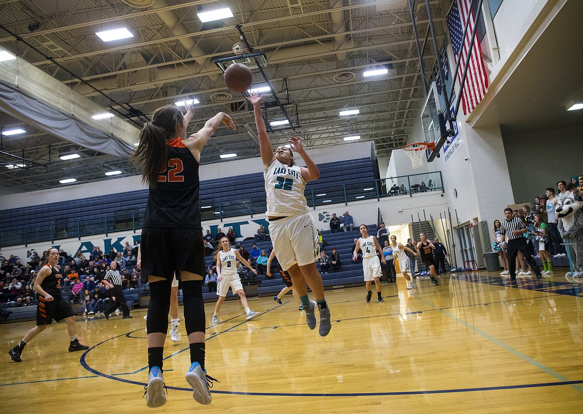 LOREN BENOIT/Press

Jacksen McCliment-Call shoots a three over Lake City&#146;s Keara Simpson during Thursday&#146;s game at Lake City High School.