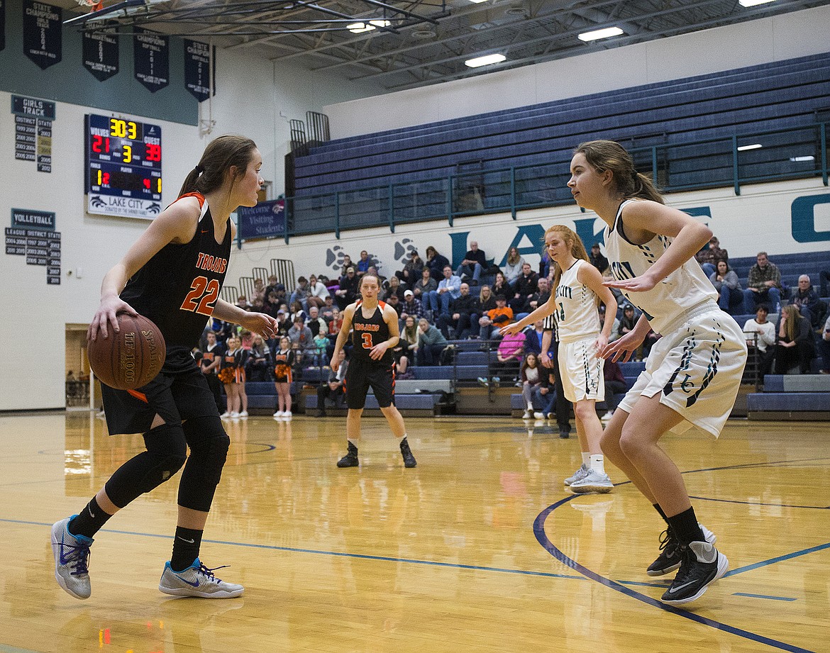 LOREN BENOIT/Press

Jacksen McCliment-Call surveys the defense as she dribbles around the arc during Thursday&#146;s game at Lake City High School.