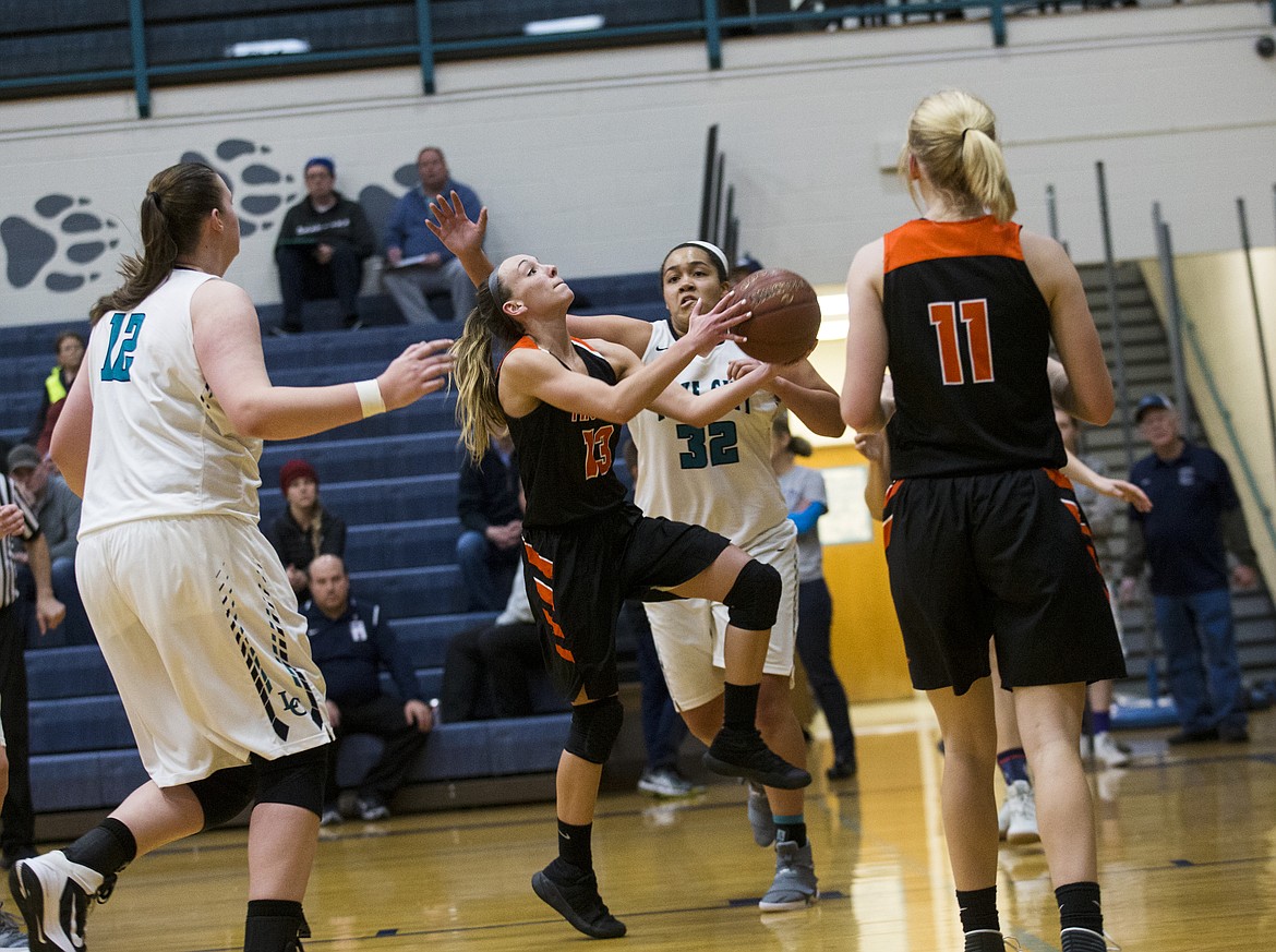 LOREN BENOIT/Press

Bayley Brennan goes for the layup during Thursday&#146;s game at Lake City High School.