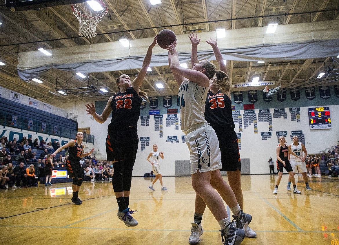 LOREN BENOIT/Press

Jacksen McCliment-Call (22) blocks Lake City&#146;s Capriel Halliday shot during Thursday&#146;s game at Lake City High School.