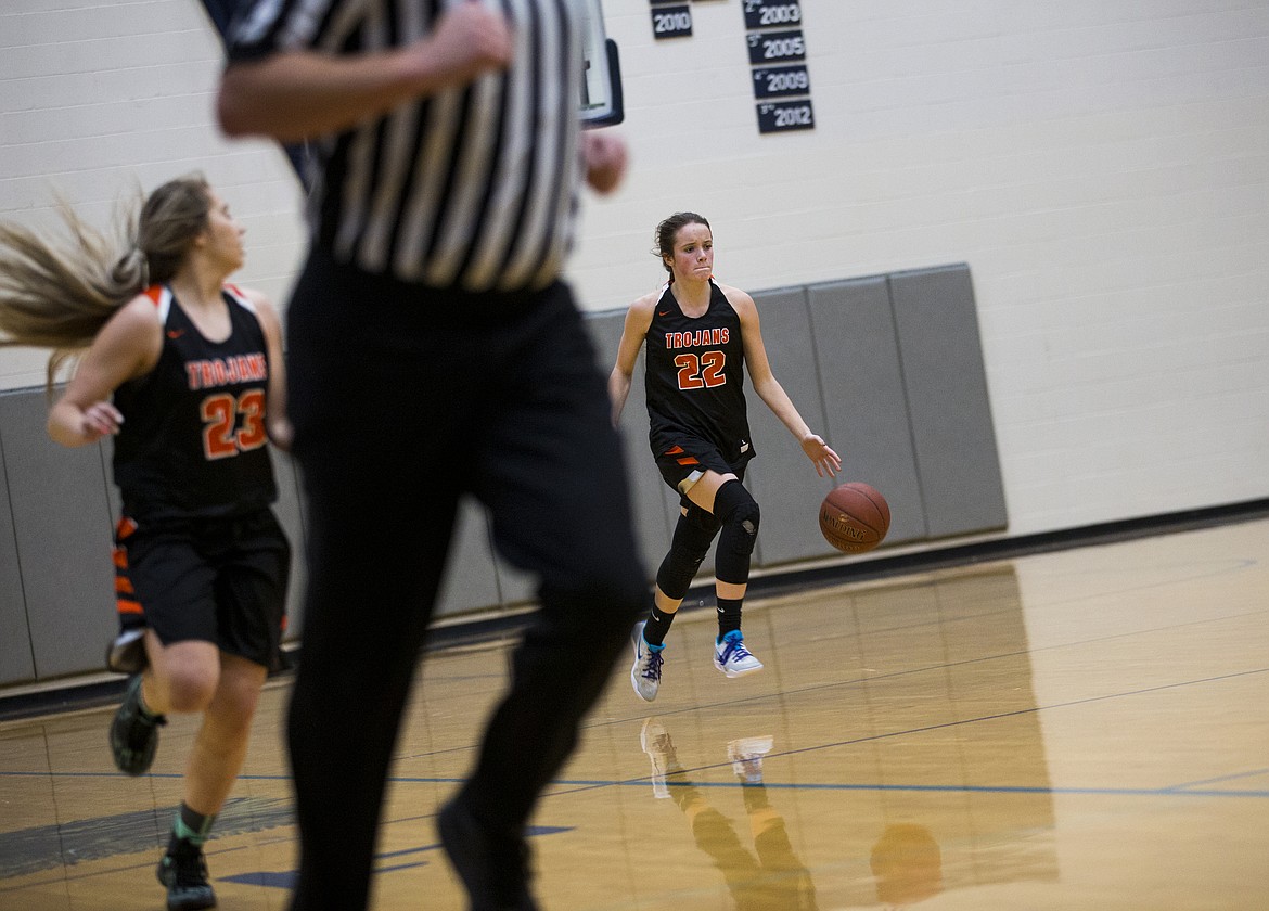 LOREN BENOIT/Press

Jacksen McCliment-Call dribbles the basketball down the court during Thursday&#146;s game at Lake City High School.