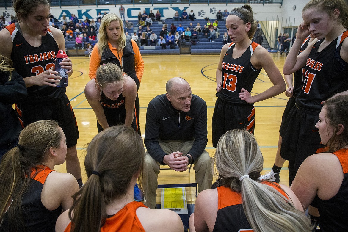 LOREN BENOIT/PressPost Falls Head Coach Marc Allert gives advice to his players during a timeout.