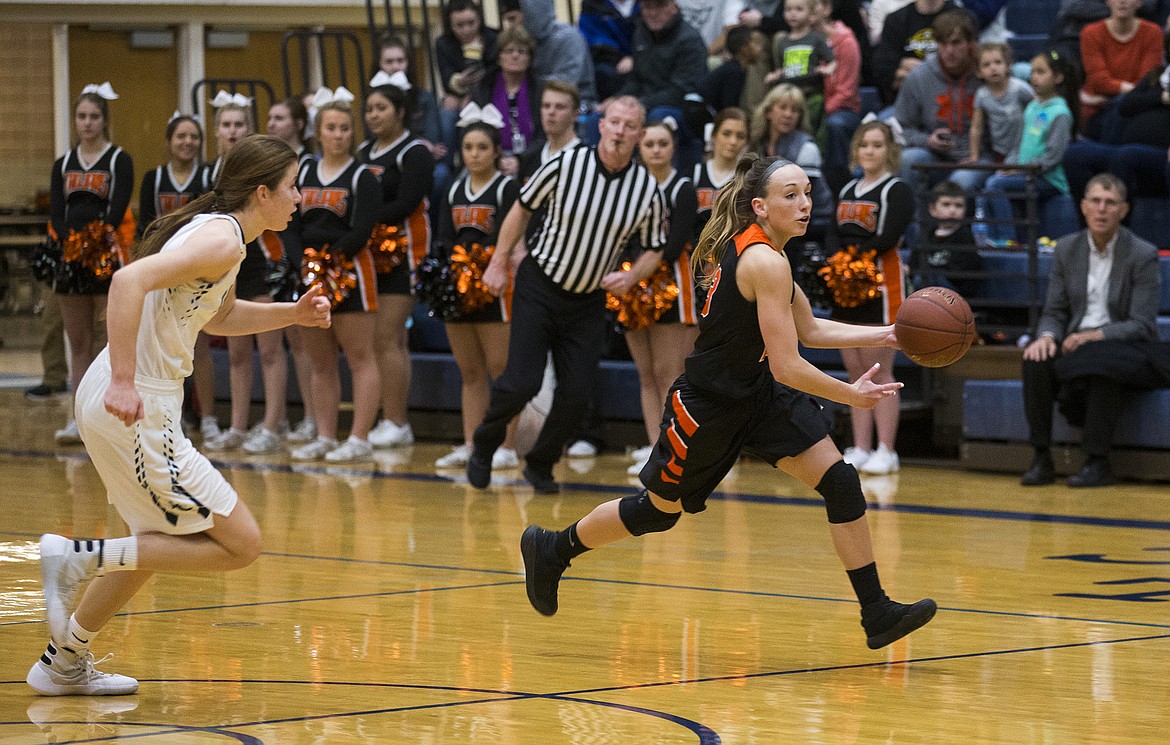 LOREN BENOIT/Press

Bayley Brennan dribbles the ball on a fast break during Thursday&#146;s game at Lake City High School.