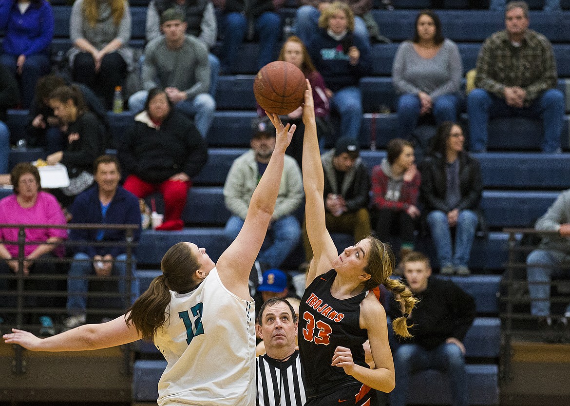 Post Falls junior Melody Kempton wins the opening tip from Lake City&#146;s Lauren Rewers during Thursday&#146;s game at Lake City High School. 

LOREN BENOIT/Press