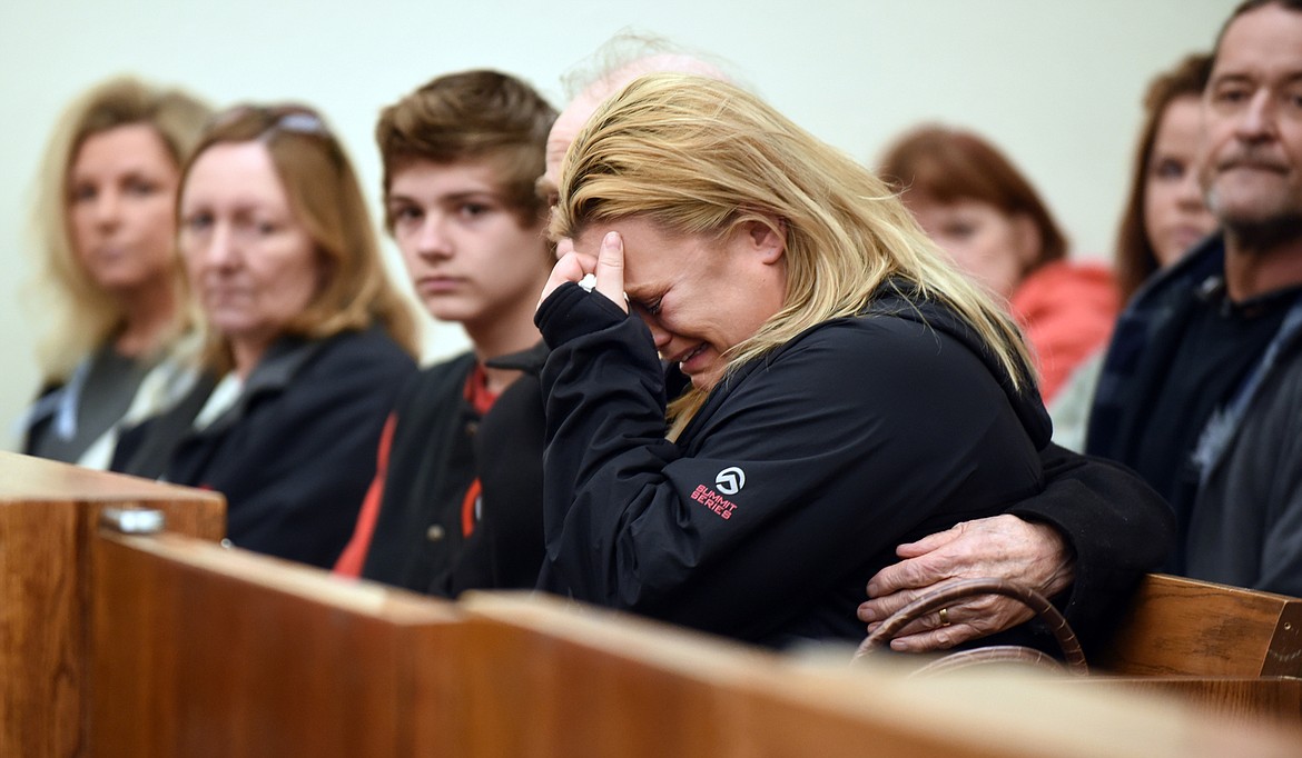 Cindy Juntunen, grandmother of Forrest Groshelle, cries in court as Brandon Newberry takes his seat with the defense lawyers on Wednesday morning, February 10, at District Court in Kalispell.&#160;(Brenda Ahearn/Daily Inter Lake)