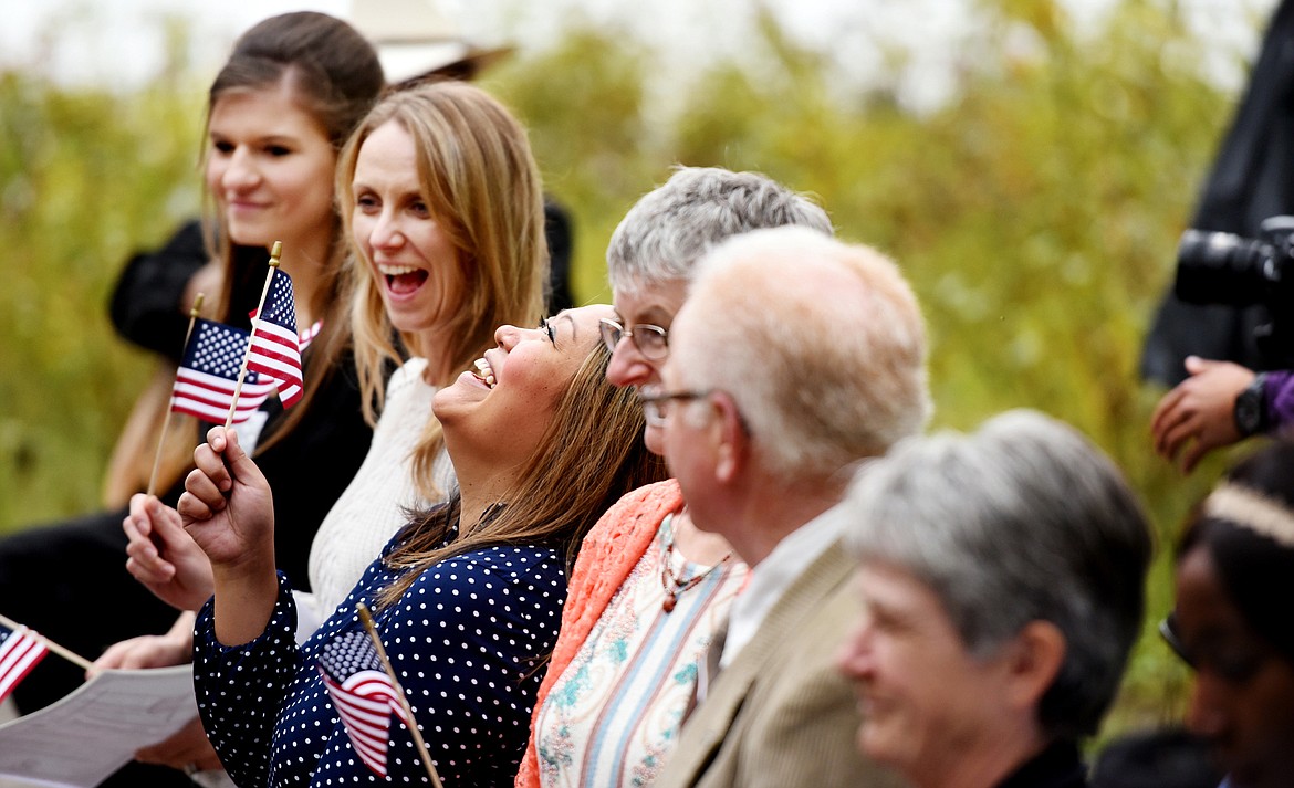 Bernadette Binoya Fuhst of the Philippines throws her head back joyfully after&#160;receiving a small American Flag as well as her American Citizenship certificate.(Brenda Ahearn/Daily Inter Lake)