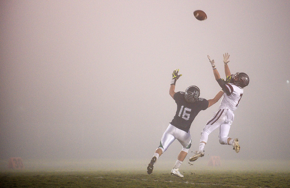 Glacier linebacker Patrick O'Connell  breaks up a pass to Helena's Matt Rispens during the Wolfpack's semifinal victory. (Aaric Bryan/Daily Inter Lake)