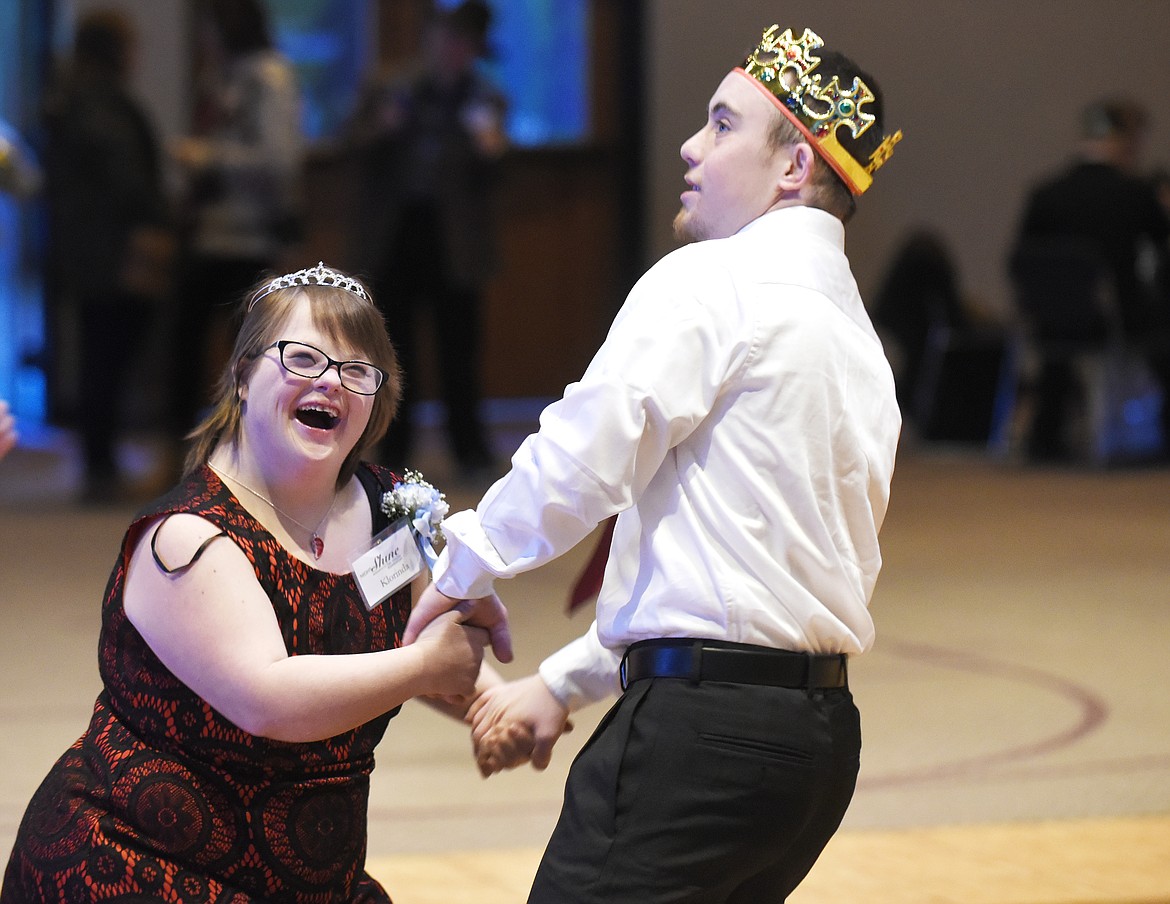 Klorinda Brown laughs as she dances with Andrew Williams during the Night to Shine prom at Canvas Church Friday. The prom is sponsored by the Tim Tebow Foundation. According to the foundation's website, there were more than 200 proms in 48 states and eight countries on Friday. (Aaric Bryan/Daily Inter Lake)
