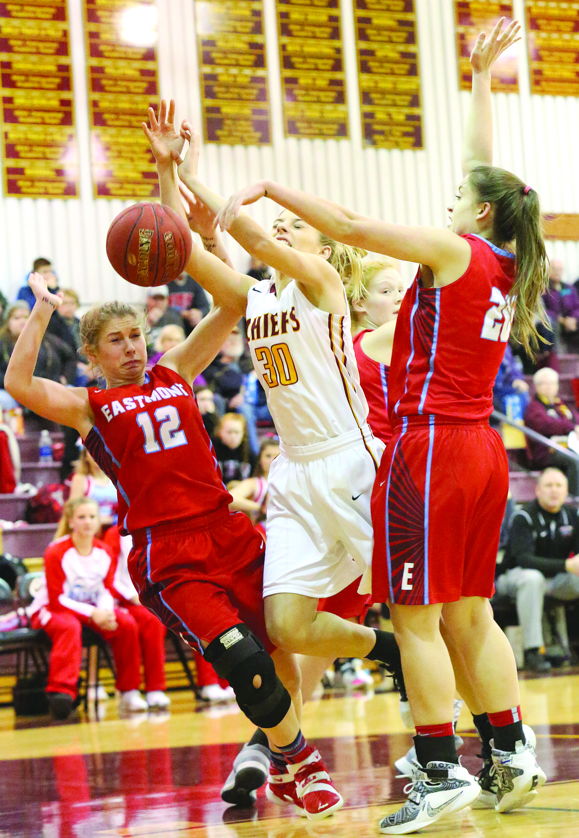 Connor Vanderweyst/Columbia Basin Herald
Moses Lake forward Jessica Olson (30) is fouled on her way to the basket against Eastmont.