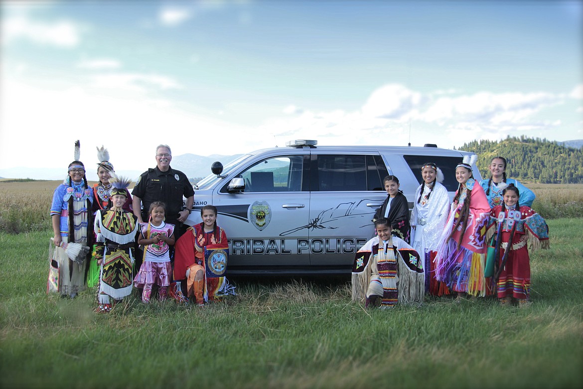 &#151;Photo by CECILLE ABRAHAM
Boundary County Sheriff-Elect David Kramer is photographed with Kootenai Tribe of Idaho youth in their regalia prior to last summer&#146;s PowWow. Kramer will offically step down from the Kootenai Tribe of Idaho Police Department and take up his new post as Boundary County Sheriff next week. &#147;I have enjoyed the opportunity to work with and for the Kootenai Tribe of Idaho as a Police Officer, and for the friendships that have been made,&#148; Kramer said. &#147;I look forward to a continued relationship with the members of the Kootenai Tribe of Idaho as Sheriff.&#148; 
Kramer, along with Boundary County Commissioner Walt Kirby, Boundary County Commissioner Dan Dinning and Boundary County Prosecuting Attorney Jack Douglas, will be sworn in on Monday, Jan. 9, at 9 a.m., inside the Boundary County Courthouse.