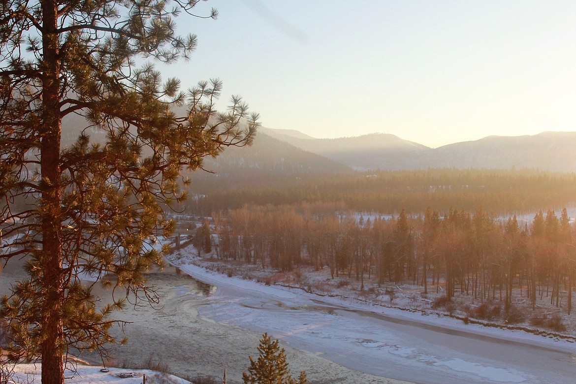 The Clark Fork River is nearly covered in a layer of ice as temperatures plummet to below zero.