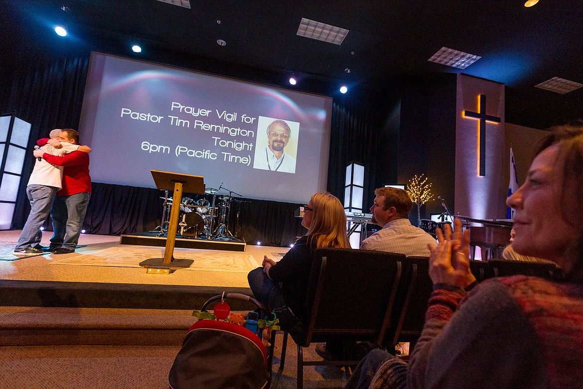 SHAWN GUST/Press file 
Altar Church members pray together during a vigil held at the church following the March 6 shooting of Pastor Tim Remington.