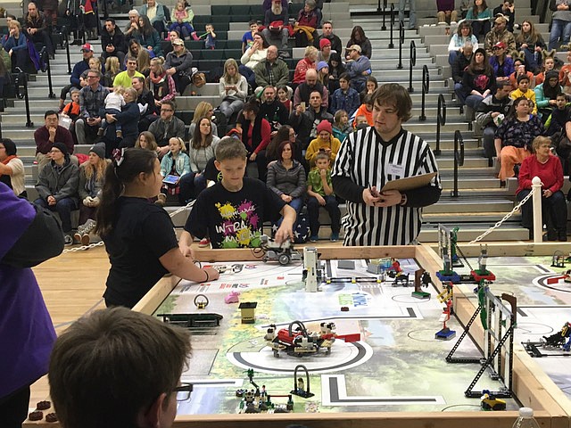 Ted Escobar/The Sun Tribune - Ashley Wisdom and Keith Brown compete in the first of three autonomous portions of the FLL competition.