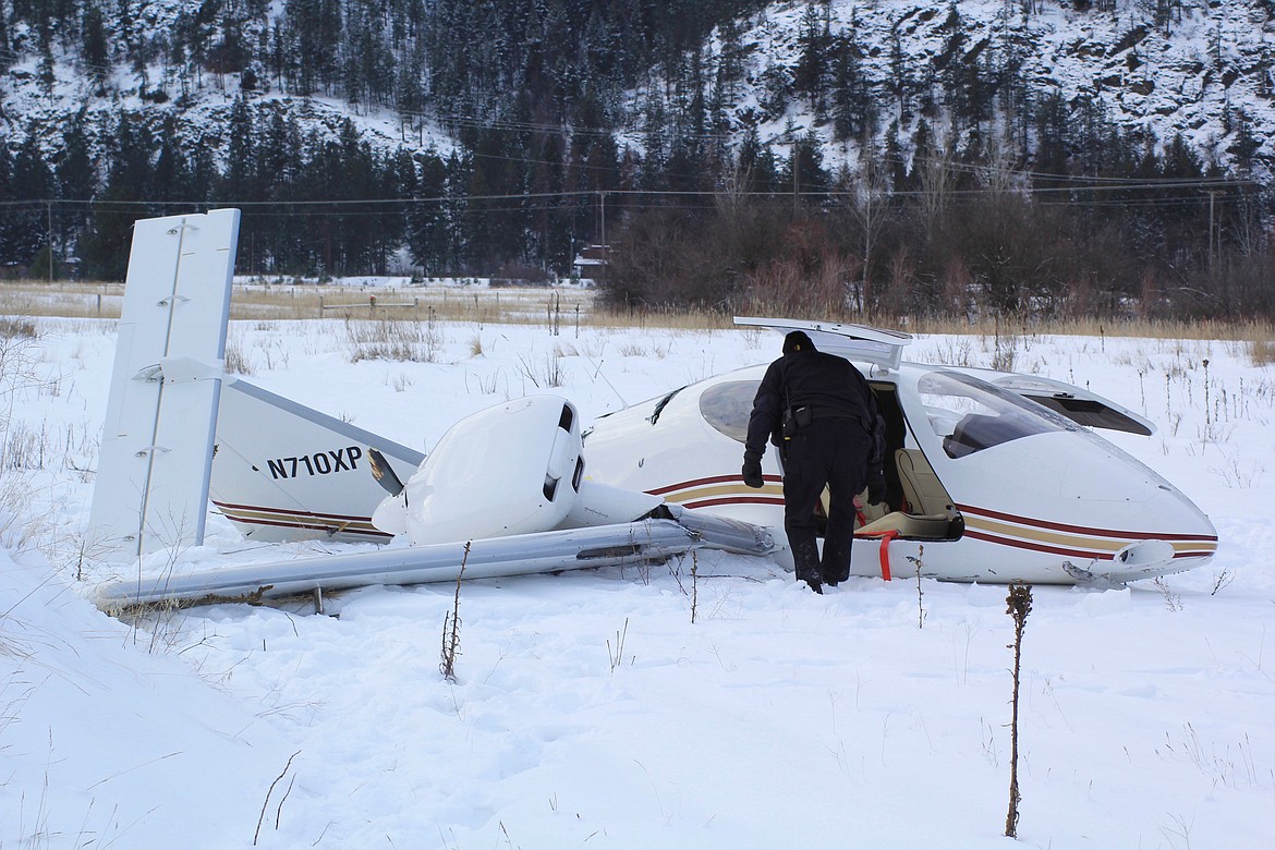 A small twin-propeller airplane crashed Tuesday, Jan. 3, at about 9:15 a.m. approximately 200 yards behind the Montana Rail Link railroad in Paradise. (Douglas Wilks/Clark Fork Valley Press)