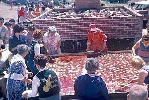 Courtesy Photo - One of the early biggest cherry pies in the world being put together in 1960.