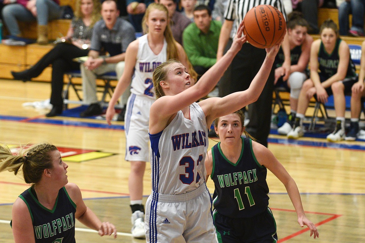 Columbia Falls forward Kiara Burlage grabs a rebound during the second quarter of the Wildkats 44-40 win over Glacier on Thursday. (Aaric Bryan/Daily Inter Lake)