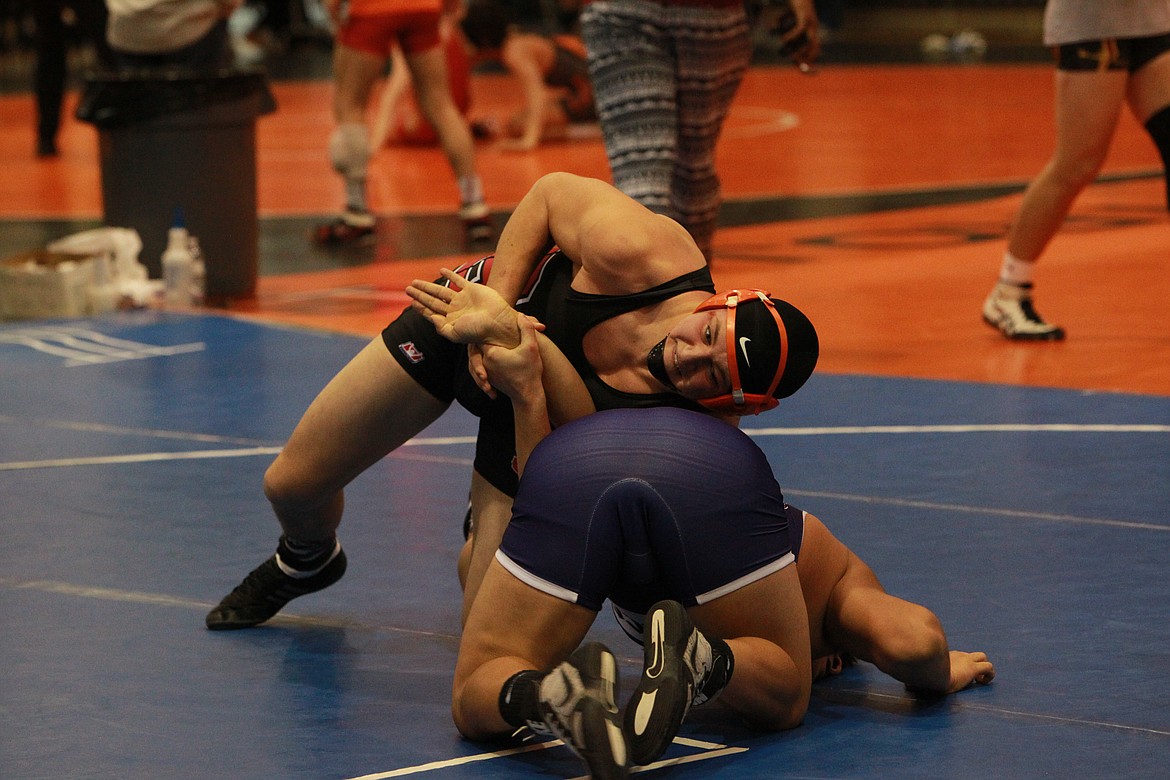 MARK NELKE/Press
Calum Wilcox, top, of Sandpoint, battles Jose Tovar of Pasco at 195 pounds in a semifinal dual in the silver bracket at the River City Duals on Saturday at Post Falls High.