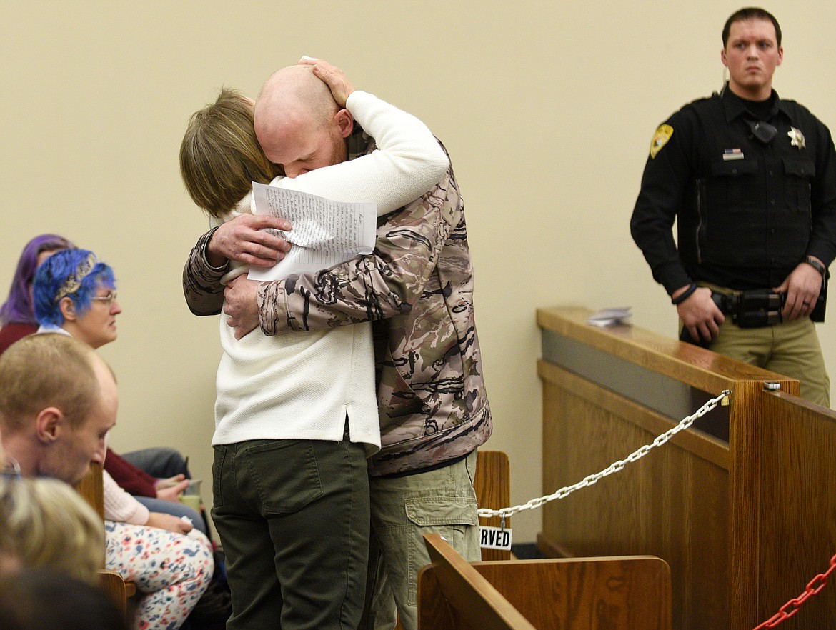 TOMI RAUTIO hugs John Claassen after he spoke at Robert Wittal&#146;s sentencing on Tuesday.