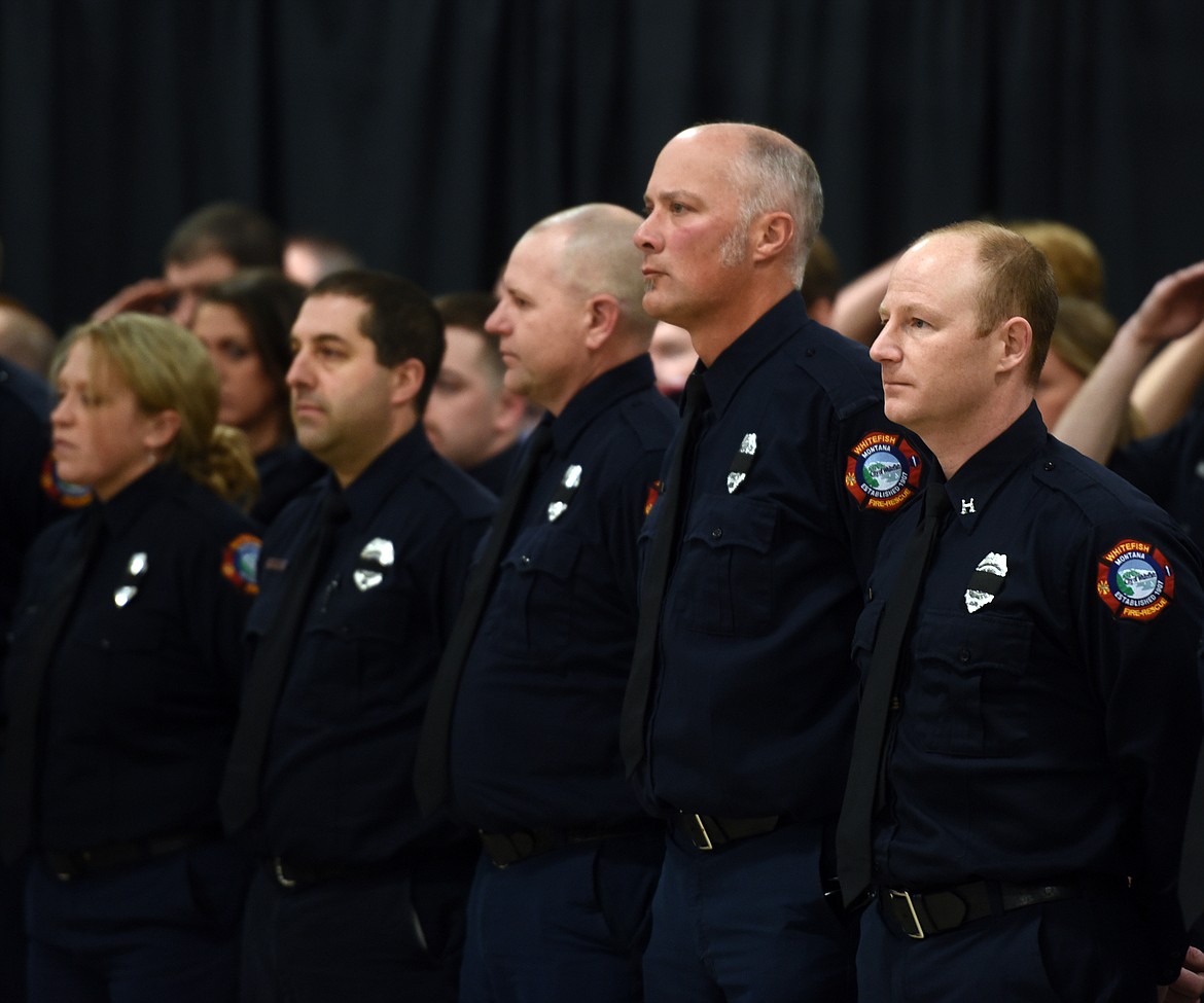 Justin Woods, right, and members of the Whitefish Fire Department land at attention as the Honor Guard keeps watch over Ben Parsons&#146; casket during the public viewing portion of the funeral on Thursday, January 12. Parsons was killed in an avalanche while descending Stanton Mountain on January 5.
(Brenda Ahearn/Daily Inter Lake)