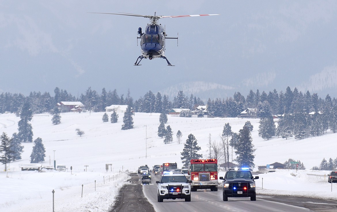 The procession for the Ben Parsons&#146; memorial service drive down U.S. 93 on Thursday. (Aaric Bryan/Daily Inter Lake)