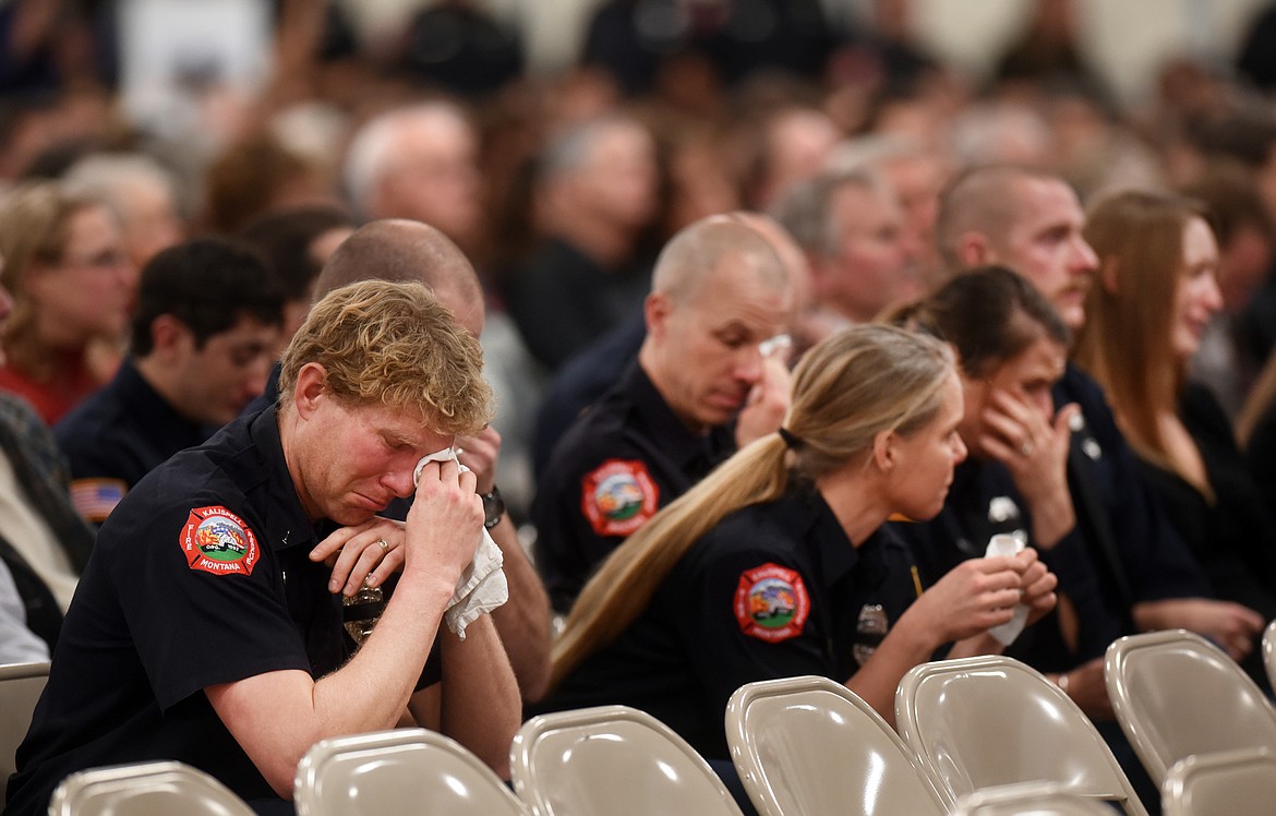 Adam Smart of the Kalispell Fire Department and others cry as the final alarm bell is rung in honor of Whitefish Firefighter Ben Parsons at his funeral on Thursday, January 12, at the Northwest Montana Fairgrounds. Smart said Parsons&#146; death was like &#147;losing a brother.&#148;&#160;Parsons was killed in an avalanche while descending Stanton Mountain on January 5.
(Brenda Ahearn/Daily Inter Lake)