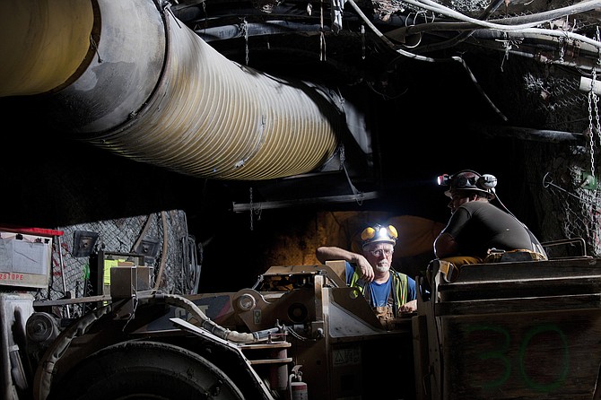 A miner operates heavy equipment inside the Lucky Friday Mine.