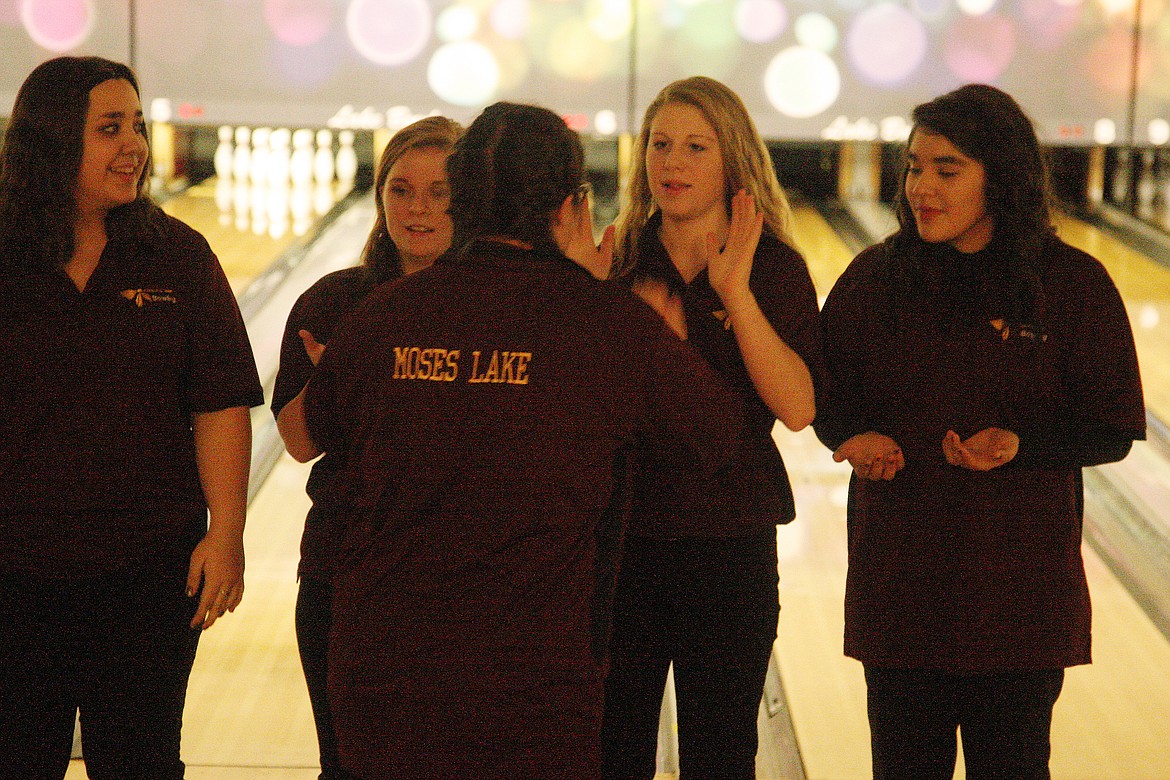 Rodney Harwood/Columbia Basin Herald
Senior Charlene Sanislo joins her Chiefs teammates one more time Thursday night at Lake Bowl. It was her final home match.