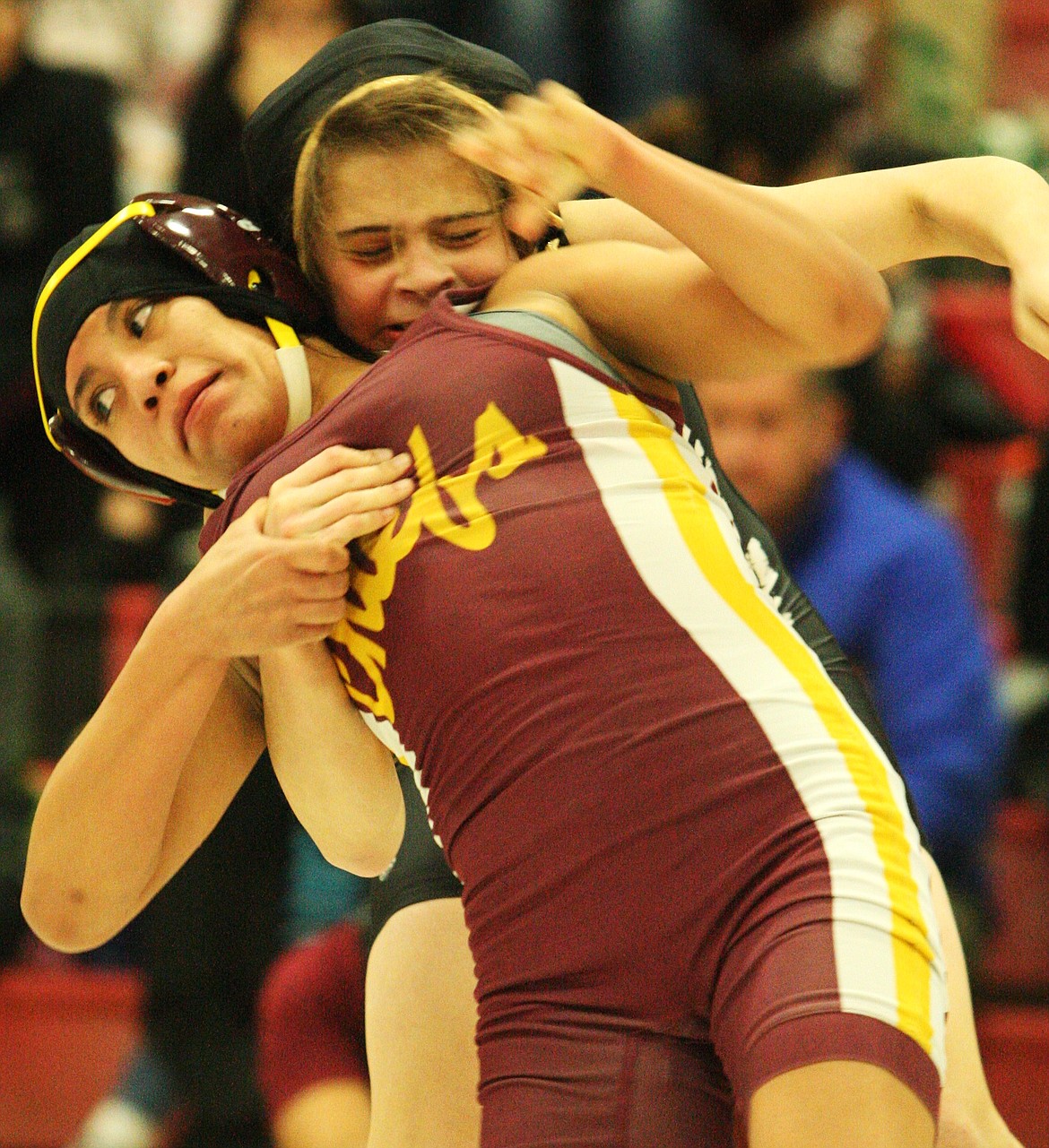 Rodney Harwood/Columbia Basin Herald
Melanie Flores of Moses Lake works to escape against Alexandra Puzon on Saturday in the championship of the 100-pound class at the Lady Huskies Invitational.