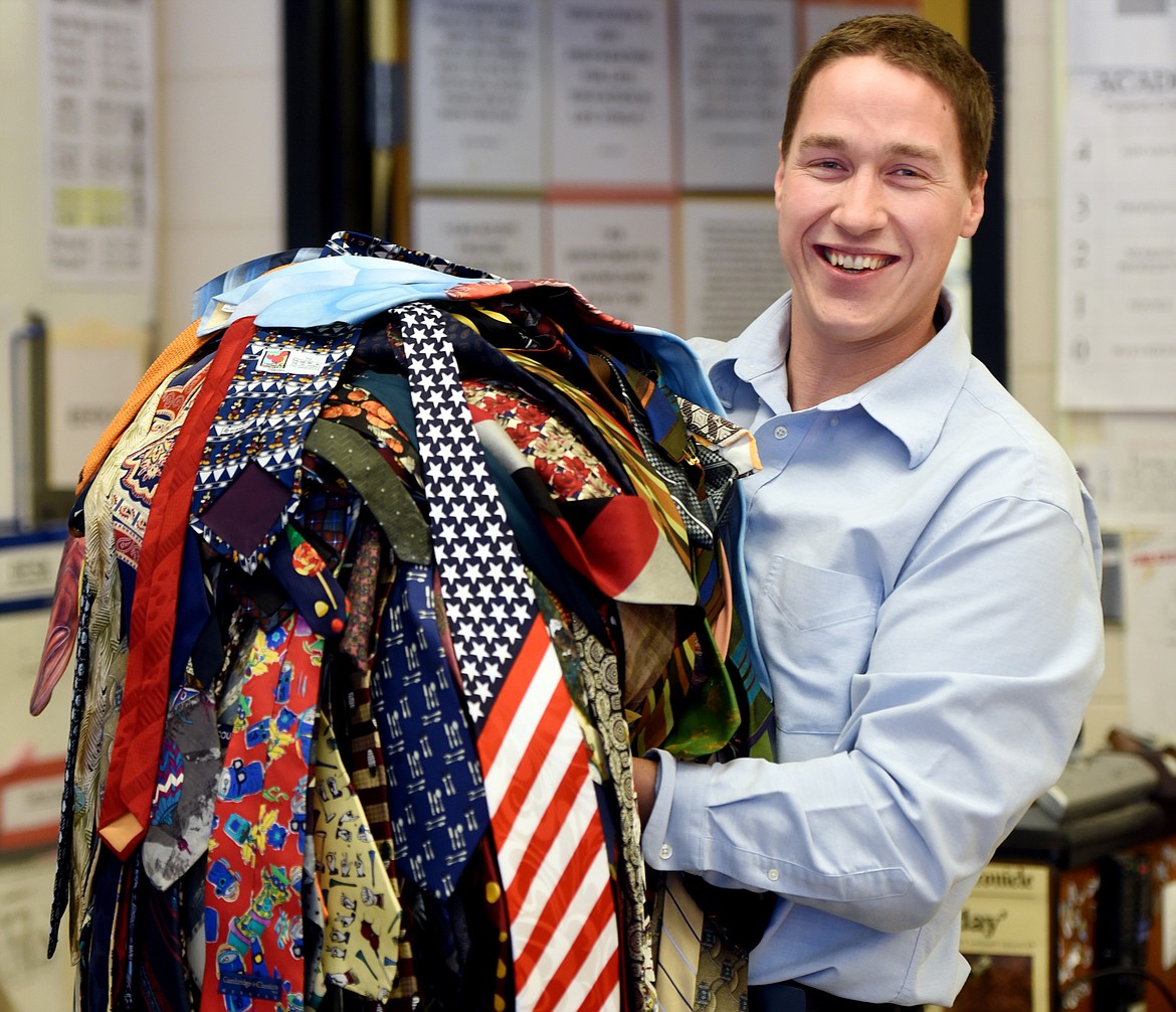 Seventh-grade history teacher Brian Fox at Kalispell Middle School with his collection of nearly 400 ties. Fox wore a different tie each day and has finally worn them all. Of the ties, Fox only purchased 10 of them. The rest have been gifts. (Brenda Ahearn photos/Daily Inter Lake)