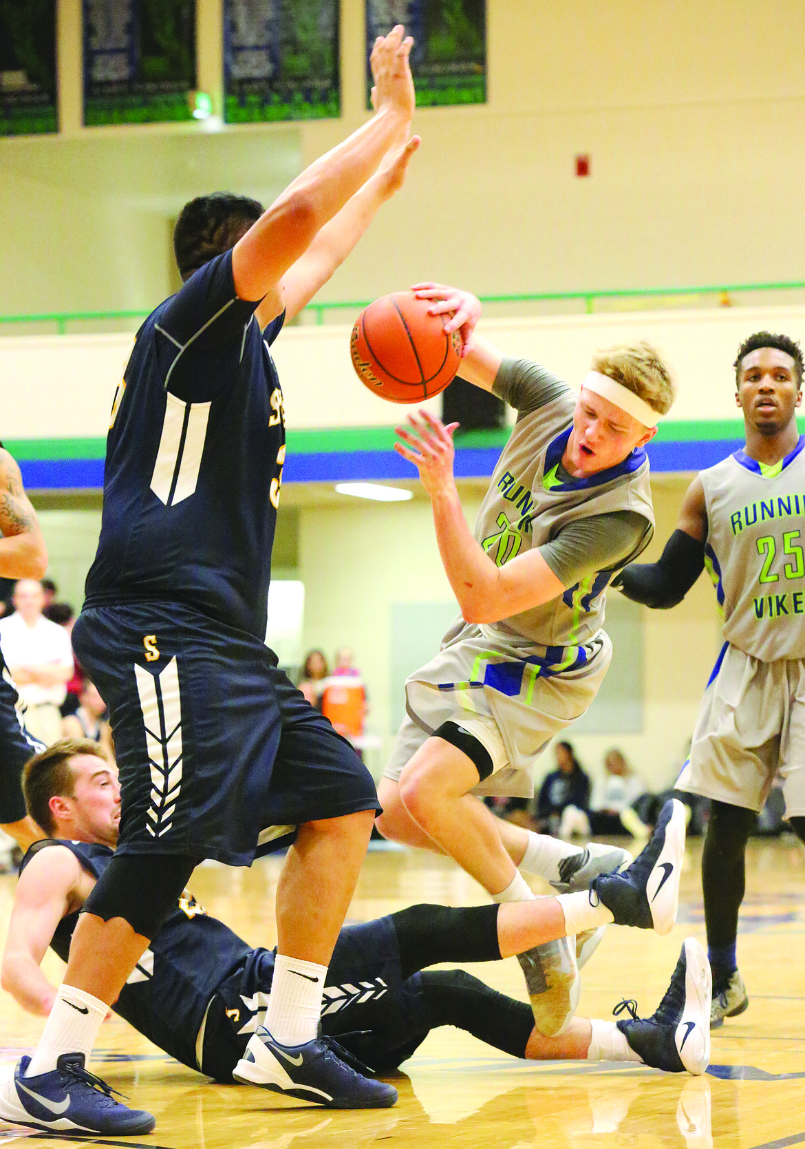 Connor Vanderweyst/Columbia Basin Herald
Big Bend's Joey Andrews collides with Spokane defenders Ryan Alexander and Cesar Sandoval.