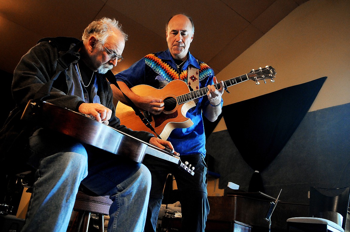 DAVID GRIFFITH and Jack Gladstone (right) rehearse at Snoring Hound Studios south of Kalispell on Thursday, Dec. 15, 2011. (Brenda Ahearn photos/This Week in the Flathead)