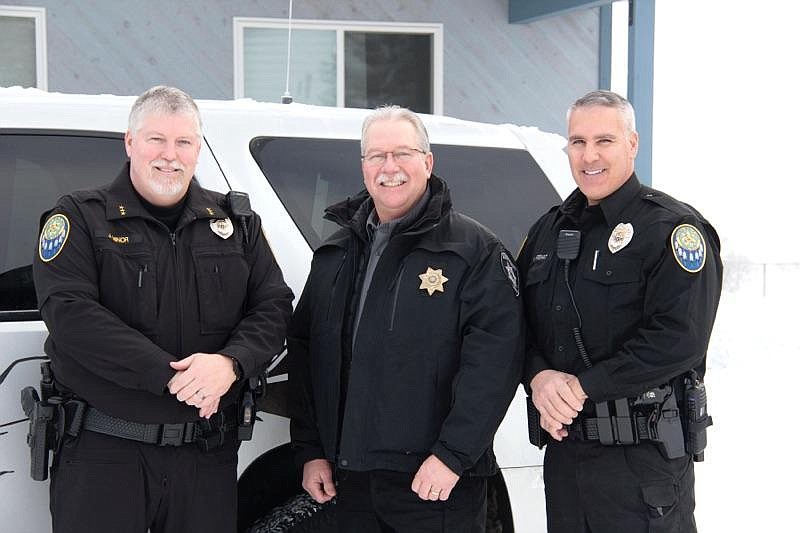 &#151;Photo by ANDREA KRAMER
Kootenai Tribal Police Chief Joel Minor, left, Boundary County Sheriff David Kramer, and Kootenai Tribal Police Officer Heiko Arshat on Tuesday at the Kootenai Tribal Police Department following the cross-deputization swearing-in ceremony.