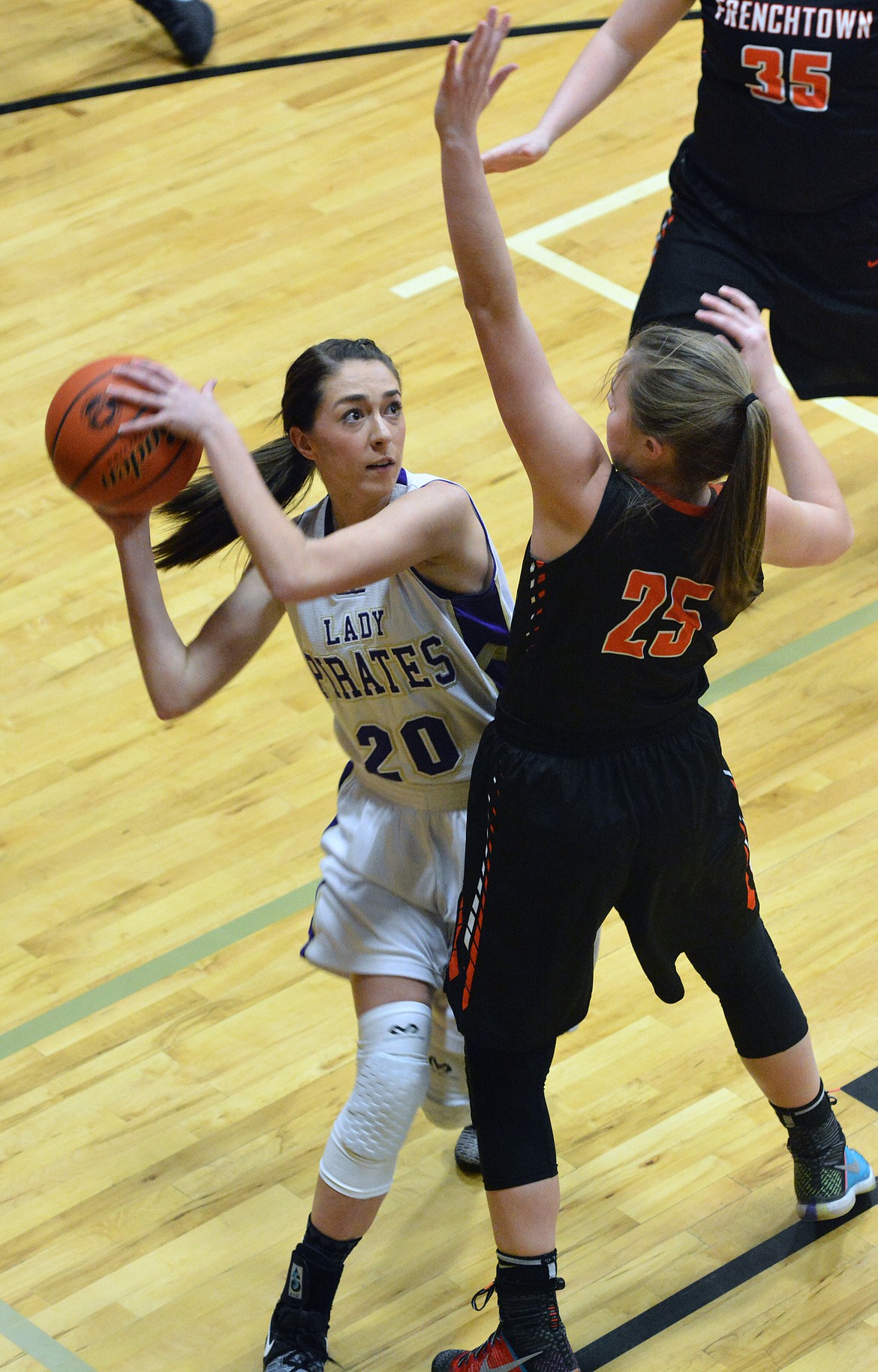 POLSON HIGH School guard Kaelyn Smith shots over a Frenchtown defender Thursday night at Linderman Elementary School. (Jason Blasco/Lake County Leader)