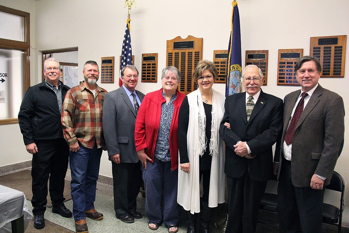 &#151;Photo by ANDREA KRAMER
Elected county officials from left to right: Boundary County Sheriff David Kramer, Boundary County Commissioner LeAlan Pinkerton, Boundary County Commissioner Dan Dinning, Boundary County Treasurer Sue Larson, Boundary County Clerk Glenda Poston, Boundary County Commissioner Walt Kirby, and Boundary County Prosecuting Attorney Jack Douglas, stand in the halls of the Boundary County Courthouse on Jan. 9, following the official swearing in ceremony.