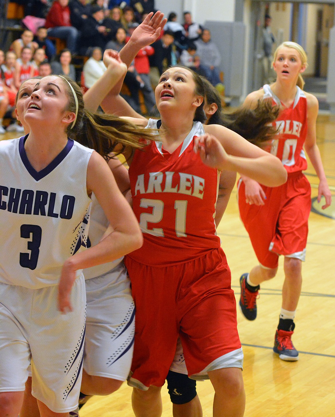 CHARLO FORWARD Cheyenne Nagy (left) and Arlee guard Nellie Desjarlais battle for the rebound in the Class-C Western conference battle between Charlo and Arlee Saturday at Charlo High School. (Jason Blasco/Lake County Leader)