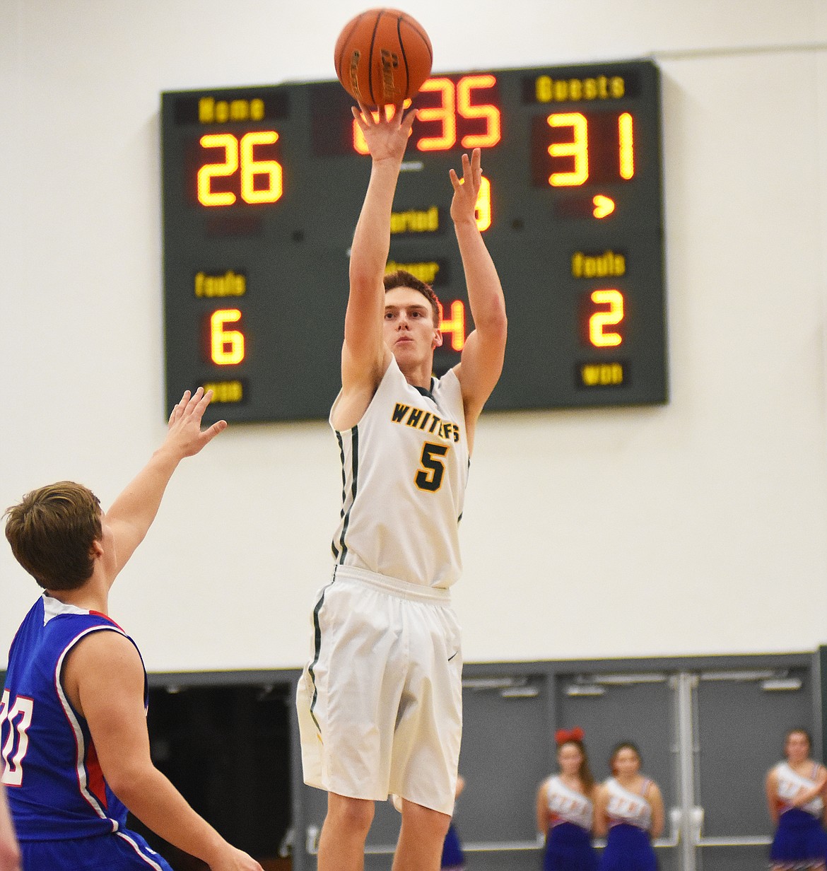 Derek Kastella launches a three against Columbia Falls.