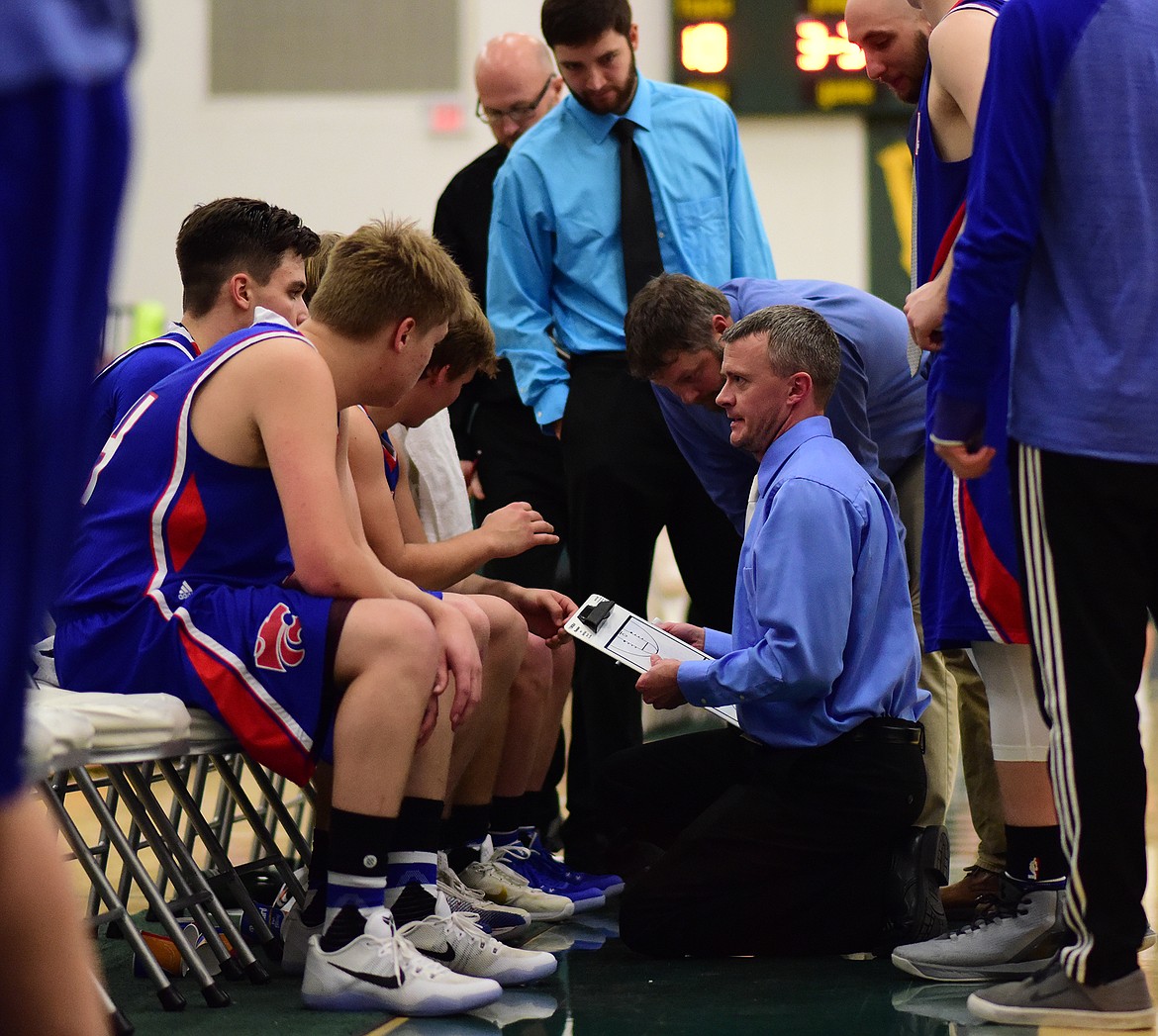 Coach Chris Finberg draws up a play late in the second half.