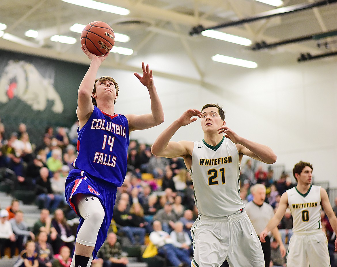 Quintin Schriver drives to the basket against the Bulldogs.