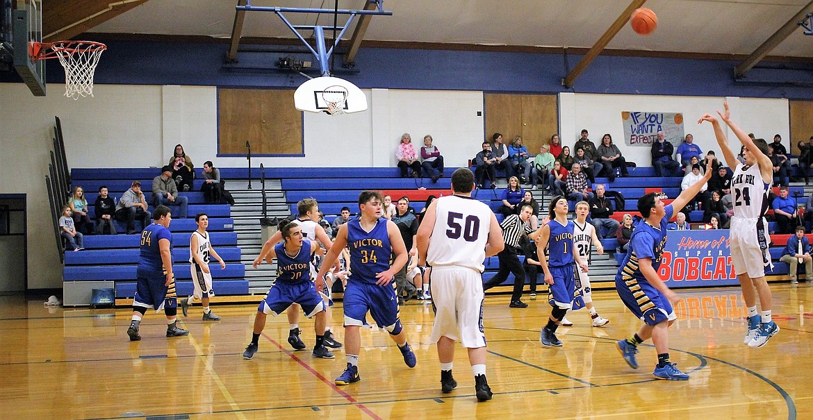 Eighth-grader Carson Callison takes a shot during the Clark Fork Mountain Cats boys&#146; Friday night&#146;s game against Victor, with a win of 51-49. (Kathleen Woodford/Mineral Independent).