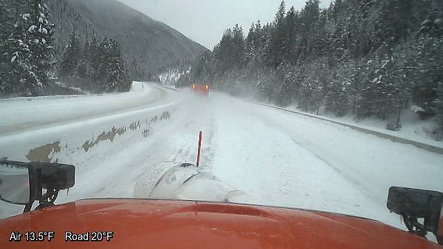 The view from a snowplow driver&#146;s seat heading up Lookout Pass on I-90. (Photo courtesy of the Montana Dept. of Transportation).